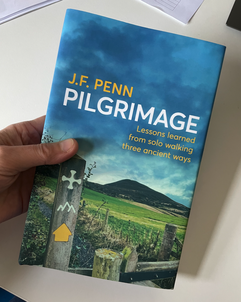 Pilgrimage hardback book held by my hand